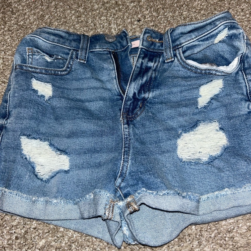 Ripped blue jean shorts